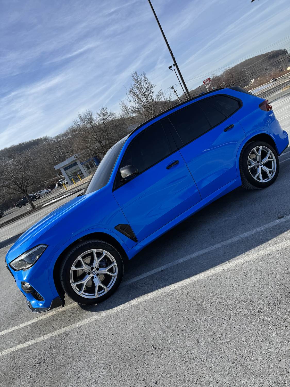 Gloss blue vinyl wrap on BMW X5